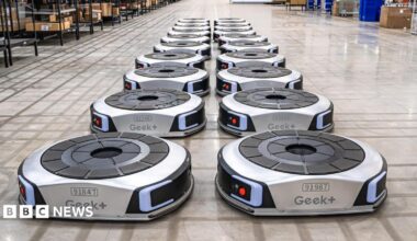Geek+ floor robots lines up in a UK warehouse