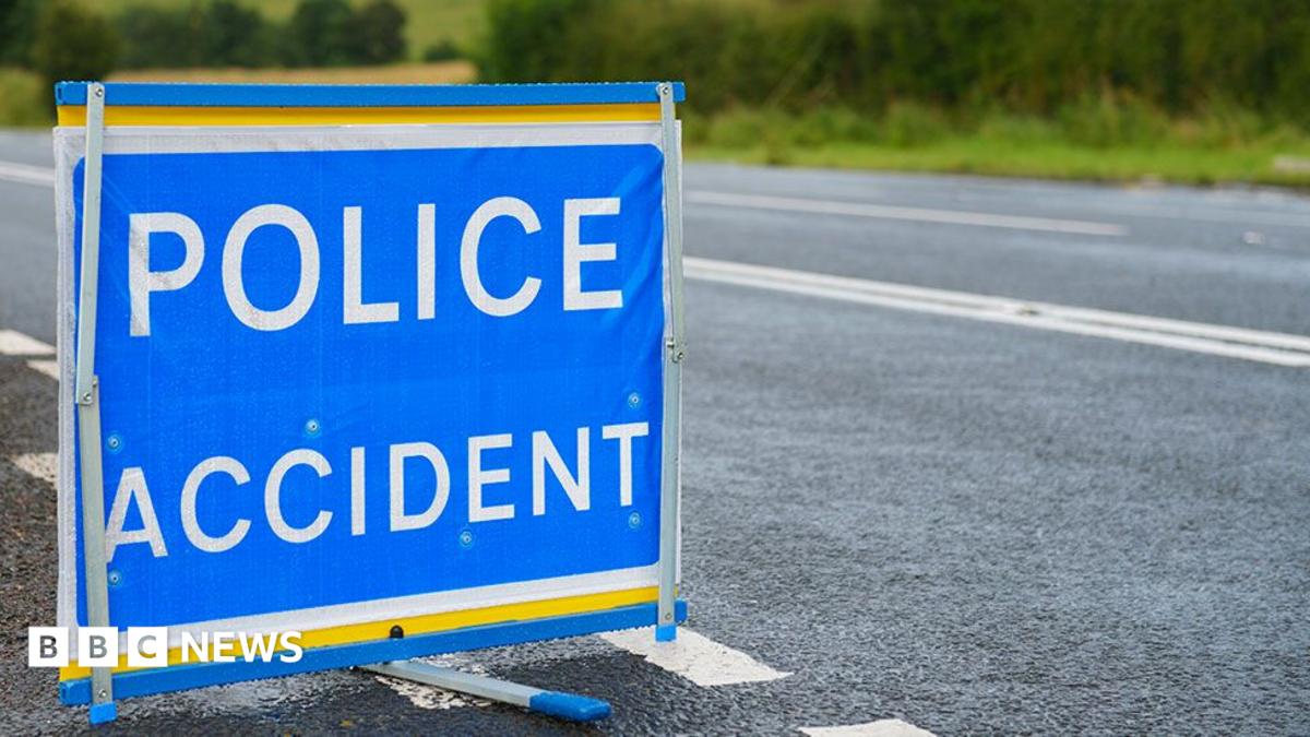 A POLICE ACCIDENT sign by the side of a country road