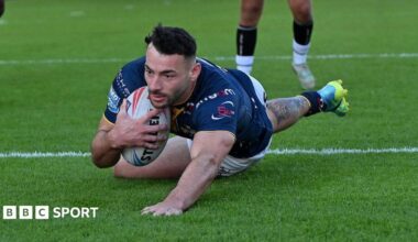 Jake Connor prepares to touch down for his first try as he slides over the line with ball tucked under his arm