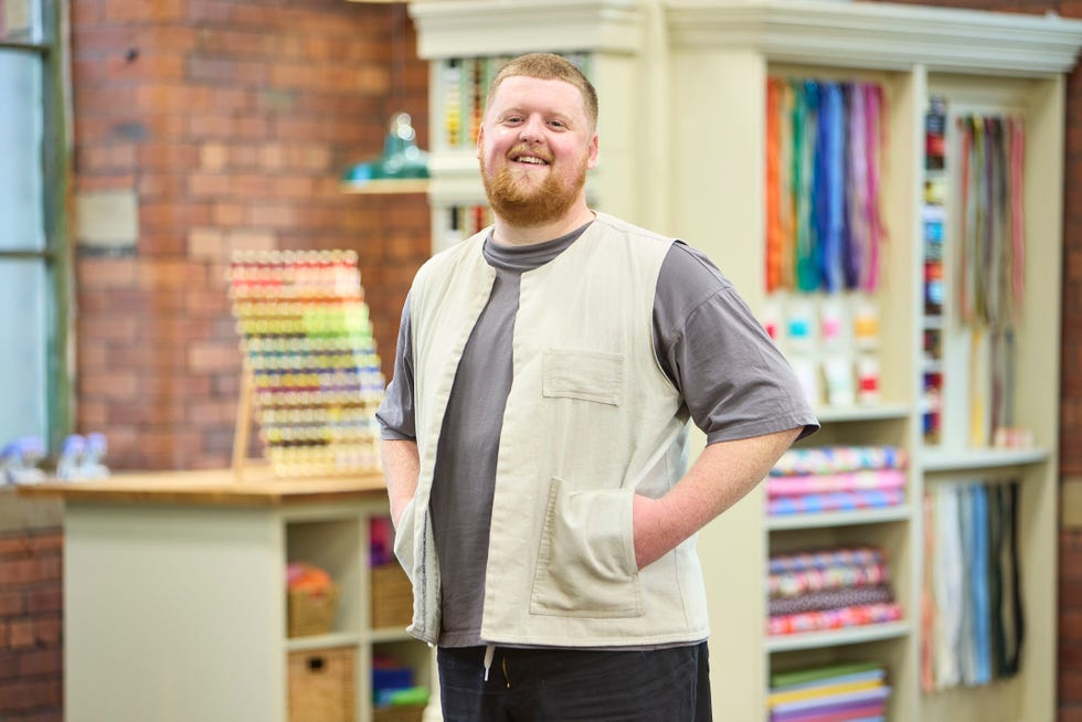Sam contestant in The Great British Sewing Bee S12 sam contestant in the great british sewing bee s12 at the mill smiling at the camera