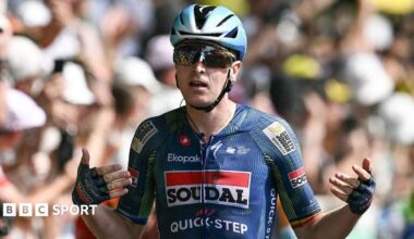 Tim Merlier celebrates winning stage seven