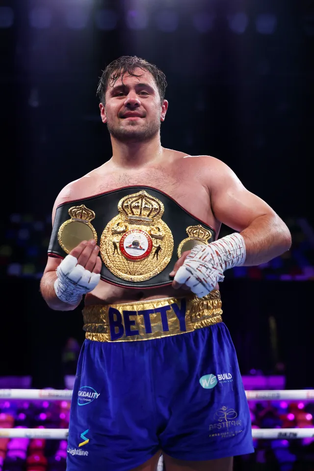 Dave Allen celebrates with his belt after victory by knock out in the Heavyweight fight between Johnny Fisher and Dave Allen as part of the Johnny Fisher v Dave Allen 2 - Fight Night at Copper Box Arena on May 17, 2025 in London, England