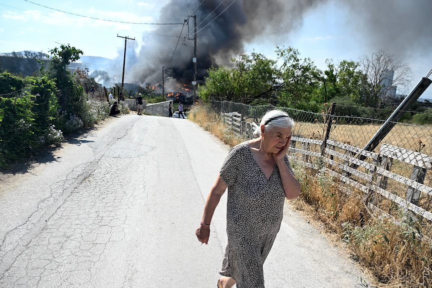 fire greece woman