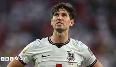 John Stones wearing an England shirt