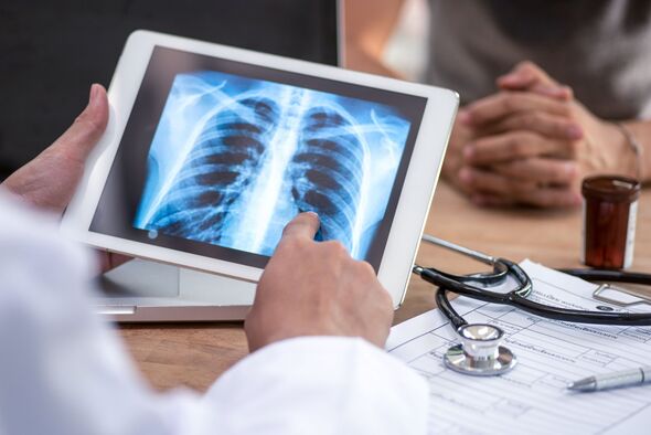 Doctor reading the scan lung on digital tablet screen. Doctor reading the scan lung on digital tablet screen.