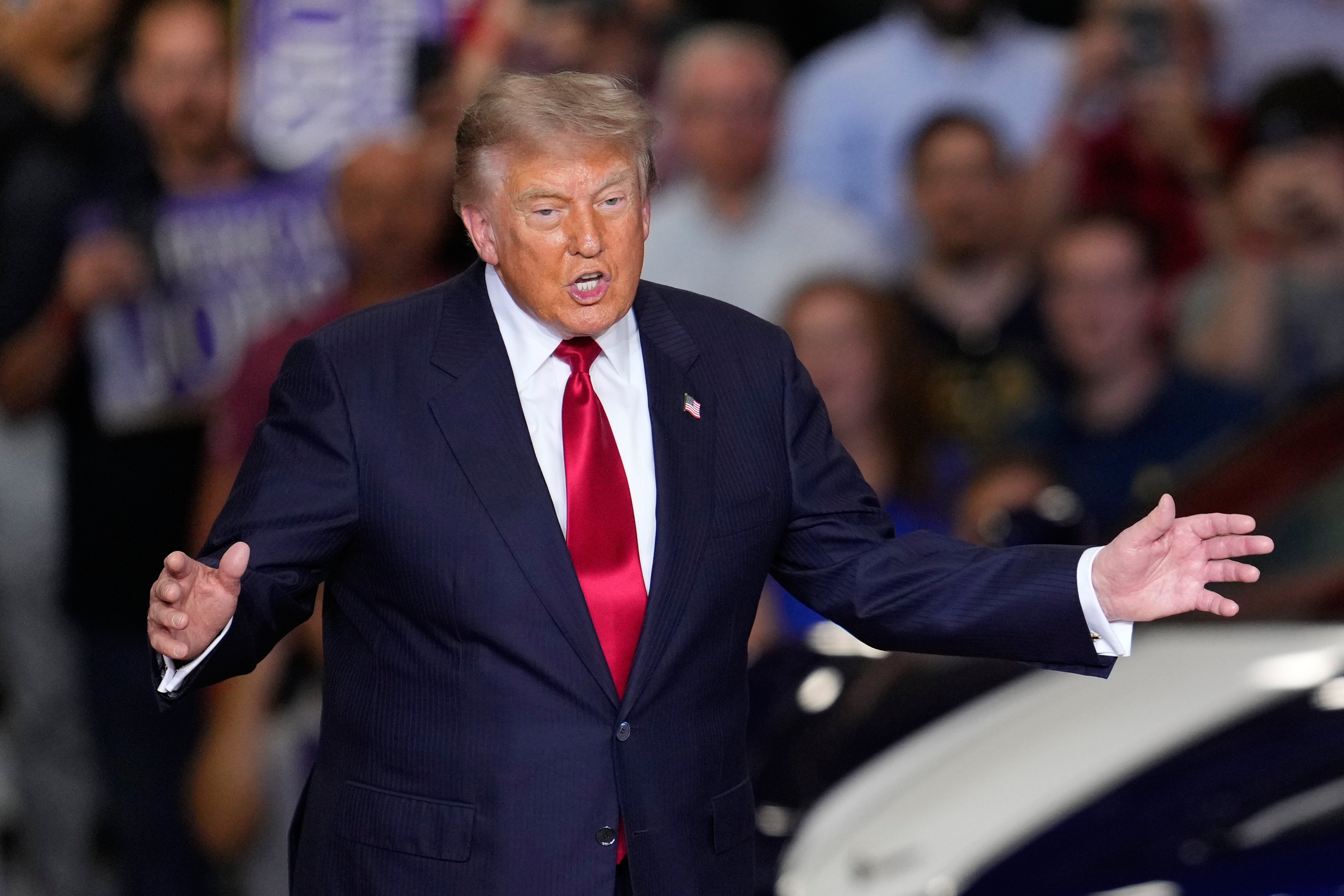 Trump hardly mentioned the name of the Michigan Senate candidate he'd come to promote as he spoke to autoworkers at the General Motors Proving Ground