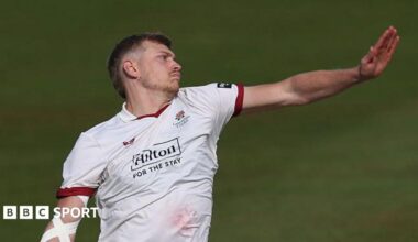 A side-on shot of Mitch Stanley bowling for Lancashire in the Championship