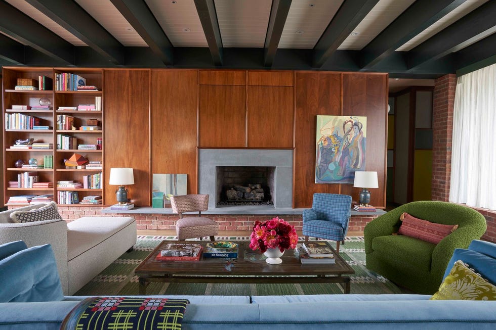 midcentry modern style living room with colorful furnishings and wood paneling