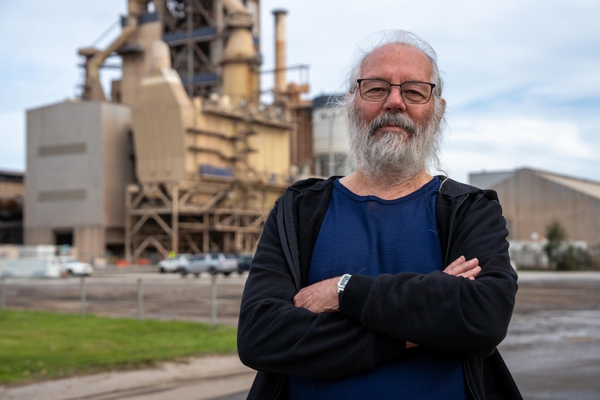 A person outside the Adbri cement factory.