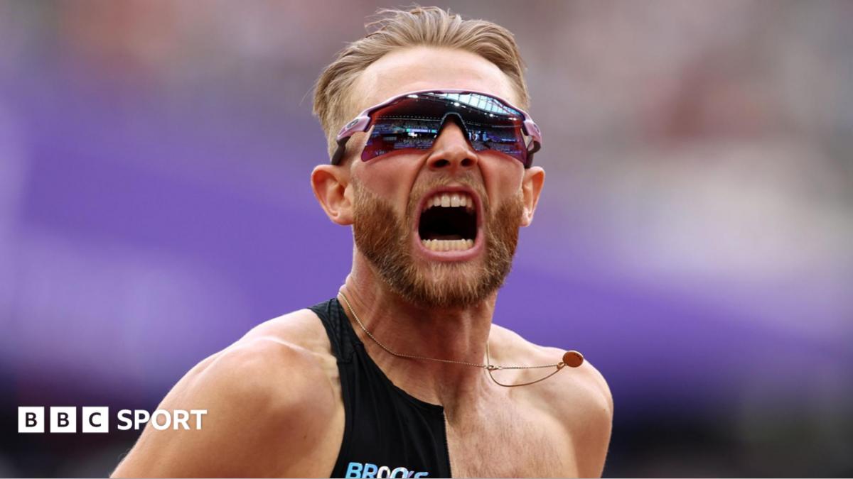 Great Britain's Josh Kerr celebrates after breaking the men's mile world record