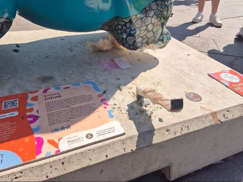 One of the statue's legs is now missing.