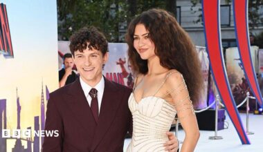 Tom Holland waving for cameras