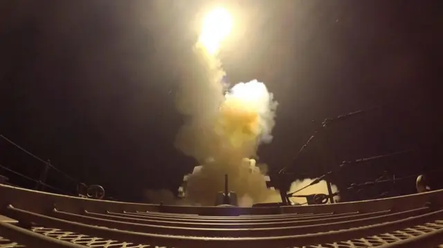 Smoke and explosions from a US gun or cannon