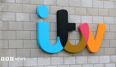 Colourful ITV logo on the side of ITV studios in Salford