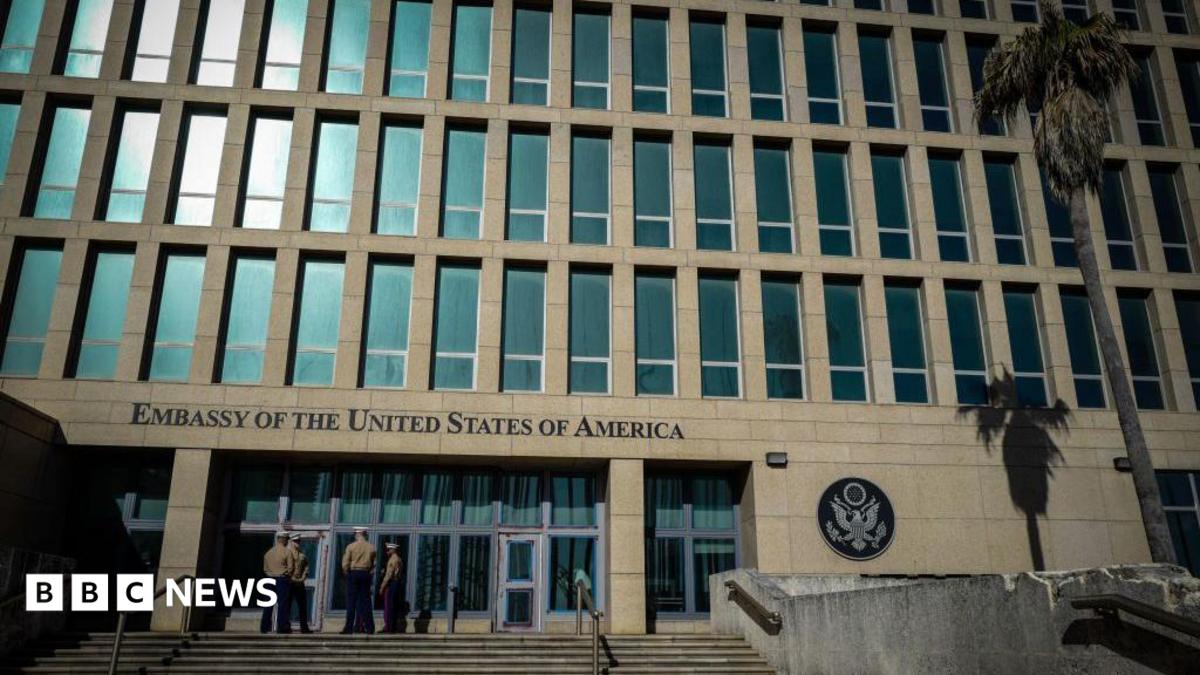 US Marines stand outside the Embassy of the United State of America in Havana, on February 21, 2018