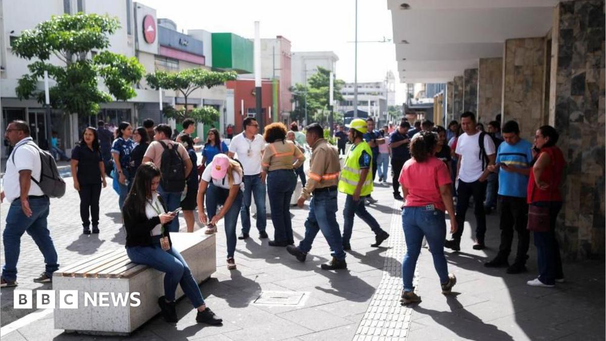 People pictured in a street in San Salvador, El Salvador's capital, following an evacuation