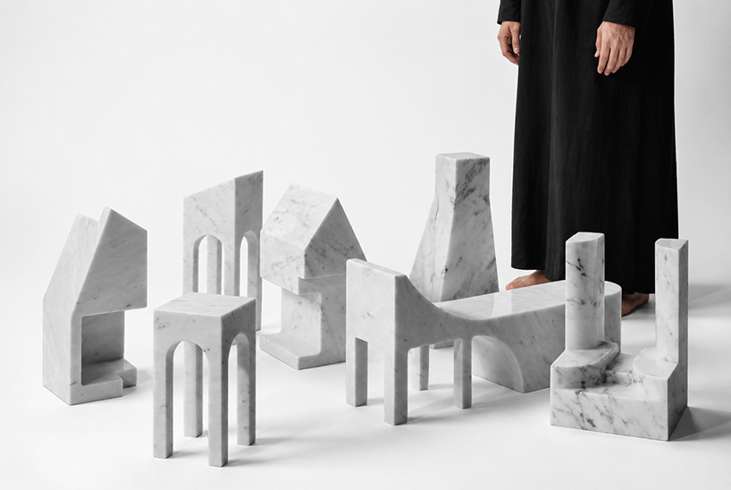 carved from solid carrara marble, abstract house-like objects explore architectural form - 1