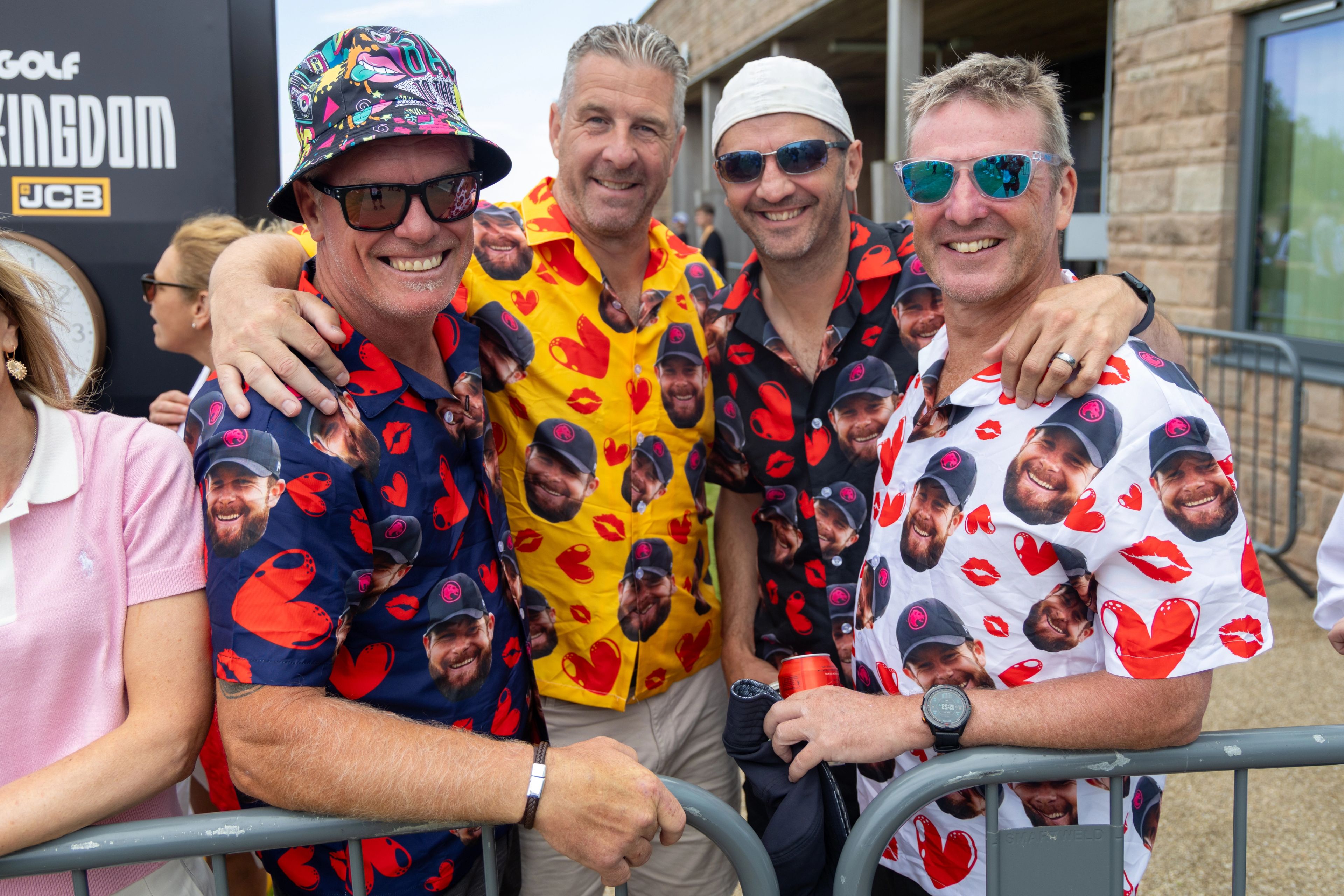Fans wear shirts with Tyrrell Hatton's head printed on them.