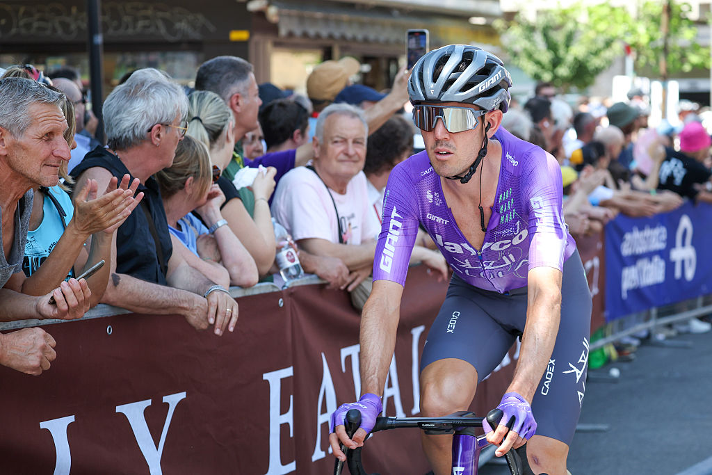 Ben O'Connor rides past spectators