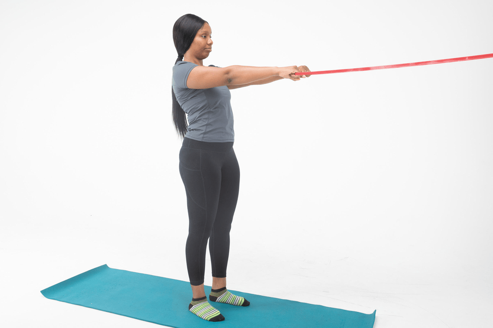 Person performing an exercise with a resistance band person performing an exercise with a resistance band