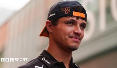 McLaren's Lando Norris wearing a McLaren cap back to front