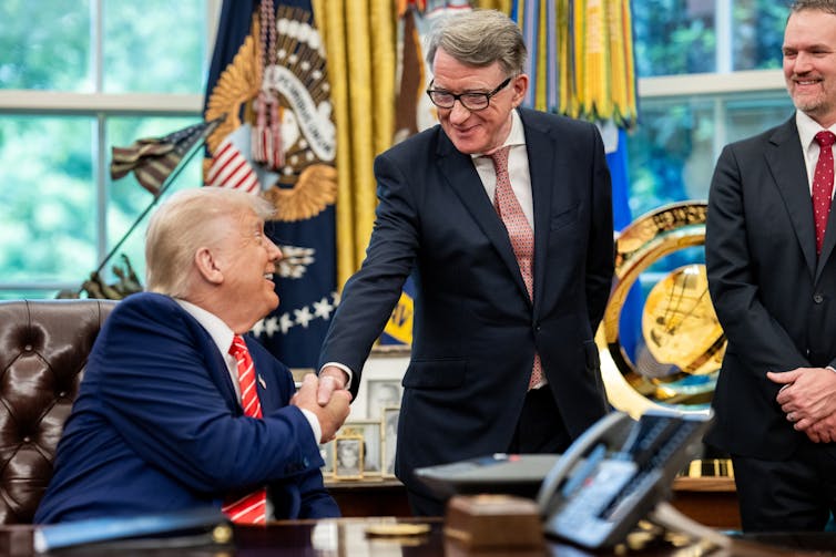 donald trump and peter mandelson shaking hands in the oval office.