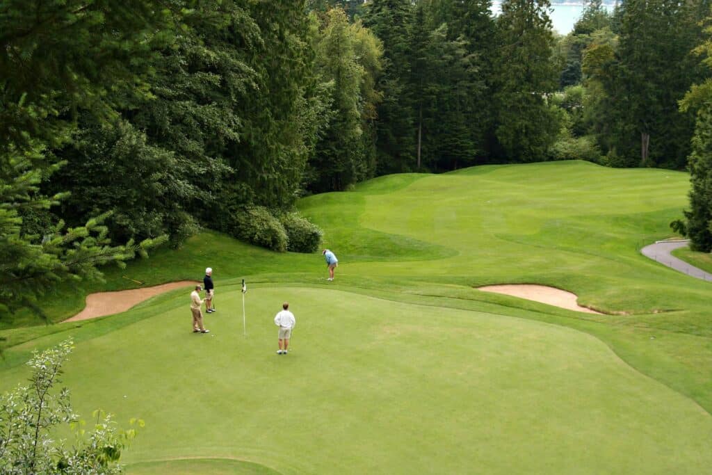 A fourball putting out on the green | Source: Adobe Stock

world handicap system