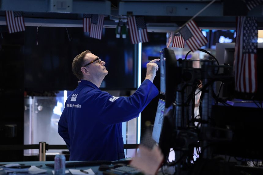 Traders work on the floor of the New York Stock Exchange during morning trading on June 26, 2026 in New York City.
