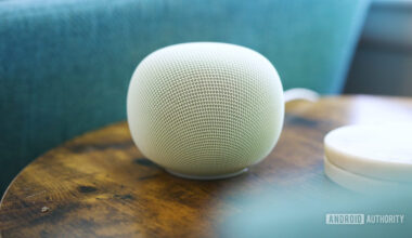 Google Home Speaker sitting on an end table.