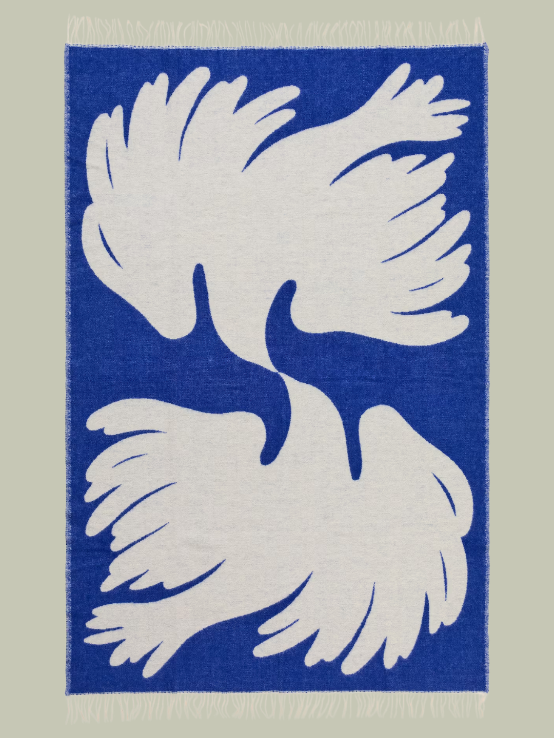 A blue throw with white doves from Arket