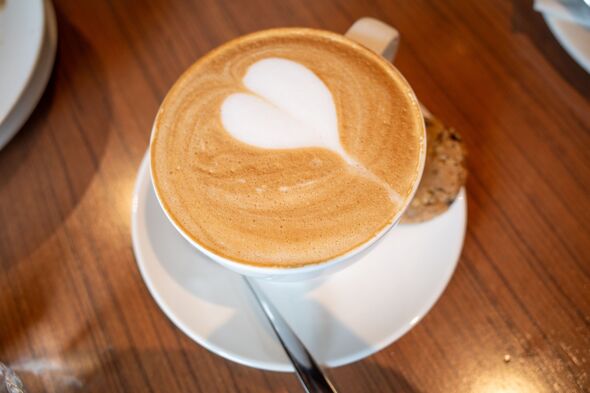 Morning Delight: Heart-Shaped Latte with a Cookie Morning Delight: Heart-Shaped Latte with a Cookie