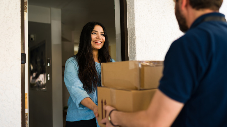 Person taking delivery of boxes