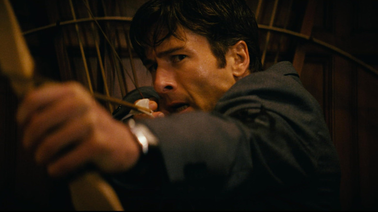 Becket Redfellow preparing to launch an arrow in How to Make a Killing (2026)