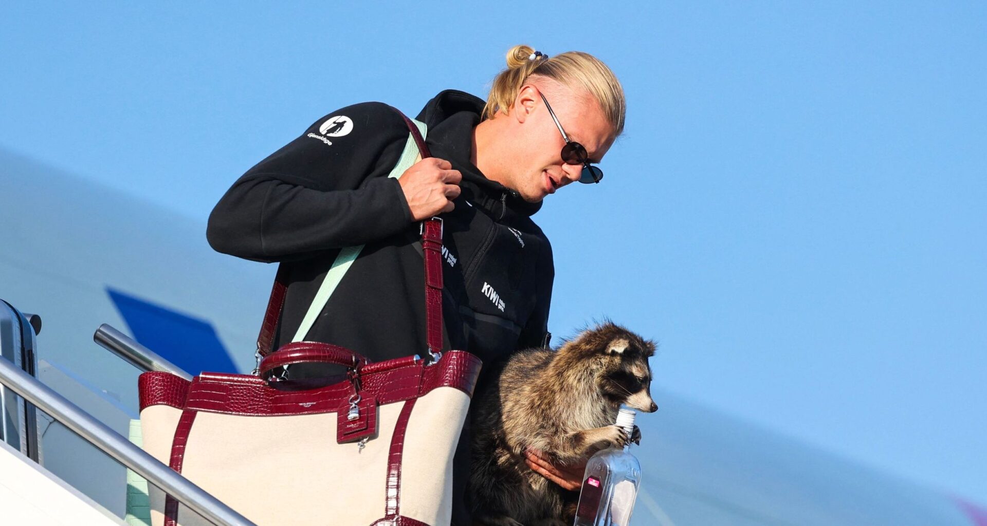 Erling Haaland shrugs off World Cup disappointment by returning to Norway with a stuffed racoon - 'It followed me home'