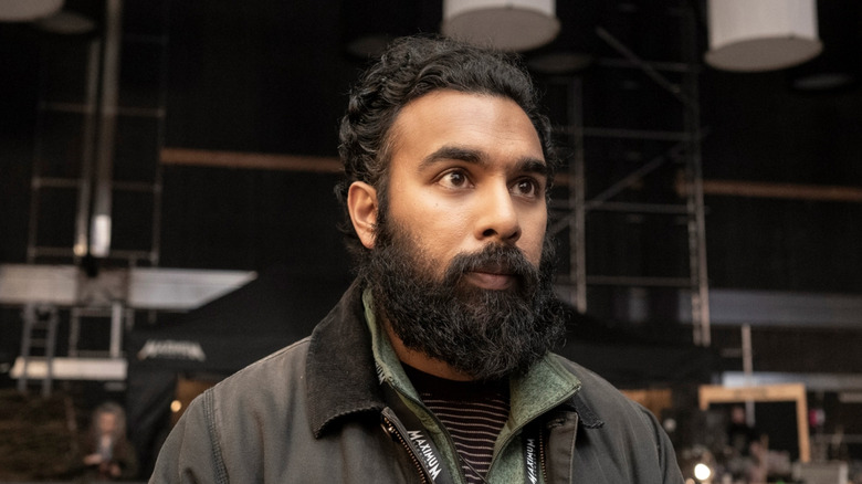 Daniel Kumar in his work vest looking dismayed in The Franchise