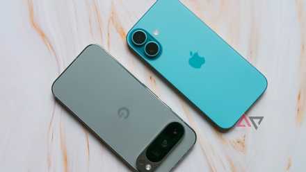 A Pixel 9 Pro lying next to an iPhone 16 on a tan backdrop.