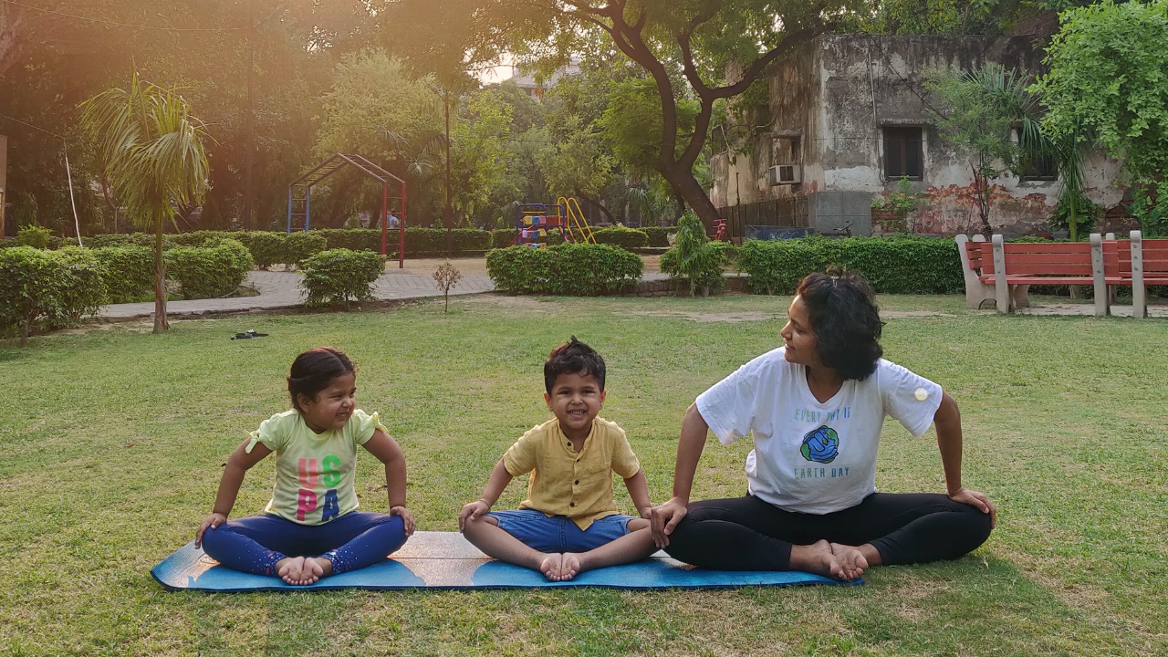 Ishu and her kids practicing yoga Ishu and her kids practicing yoga
