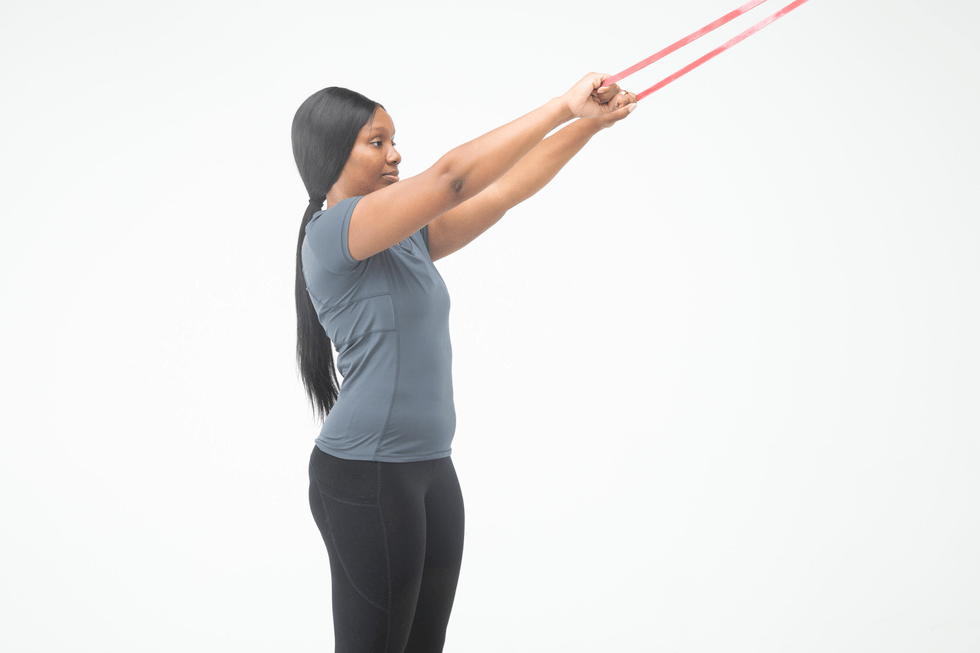 Person performing an exercise with resistance bands person performing an exercise with resistance bands