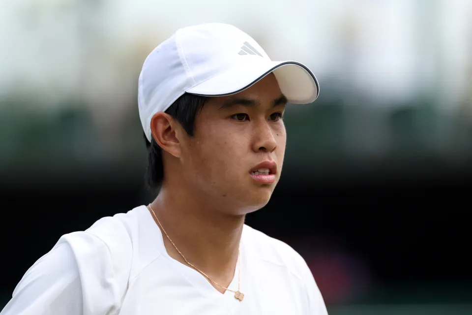 Learner Tien on court at Wimbledon