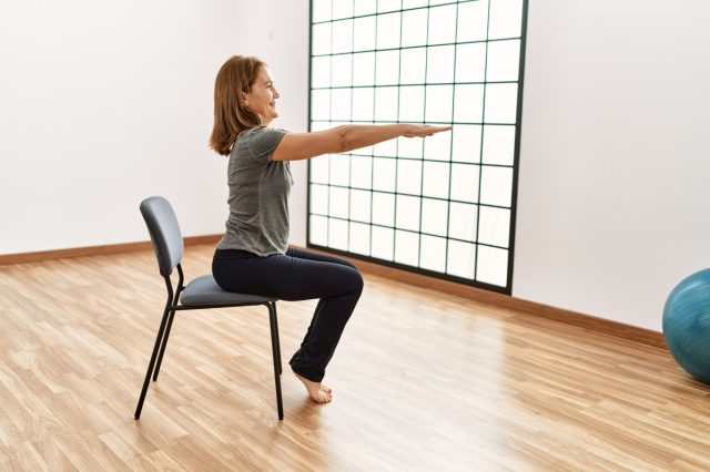 Middle age caucasian woman smiling confident training at sport center