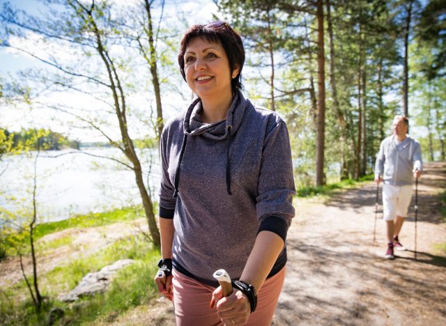 mature woman walking trail outdoors