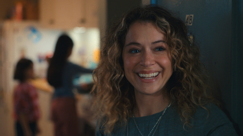 Paula standing in a doorway and smiling