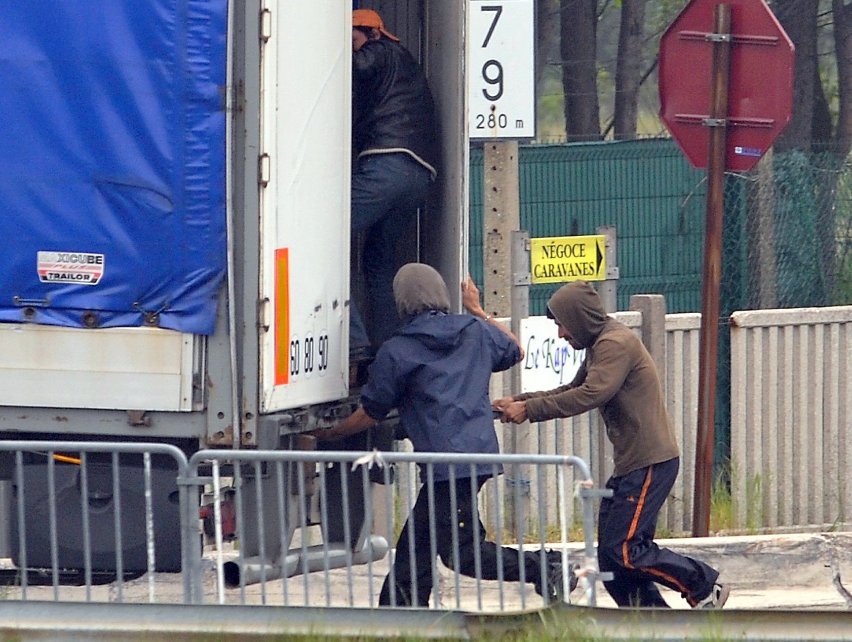 Migrants breaking into lorry