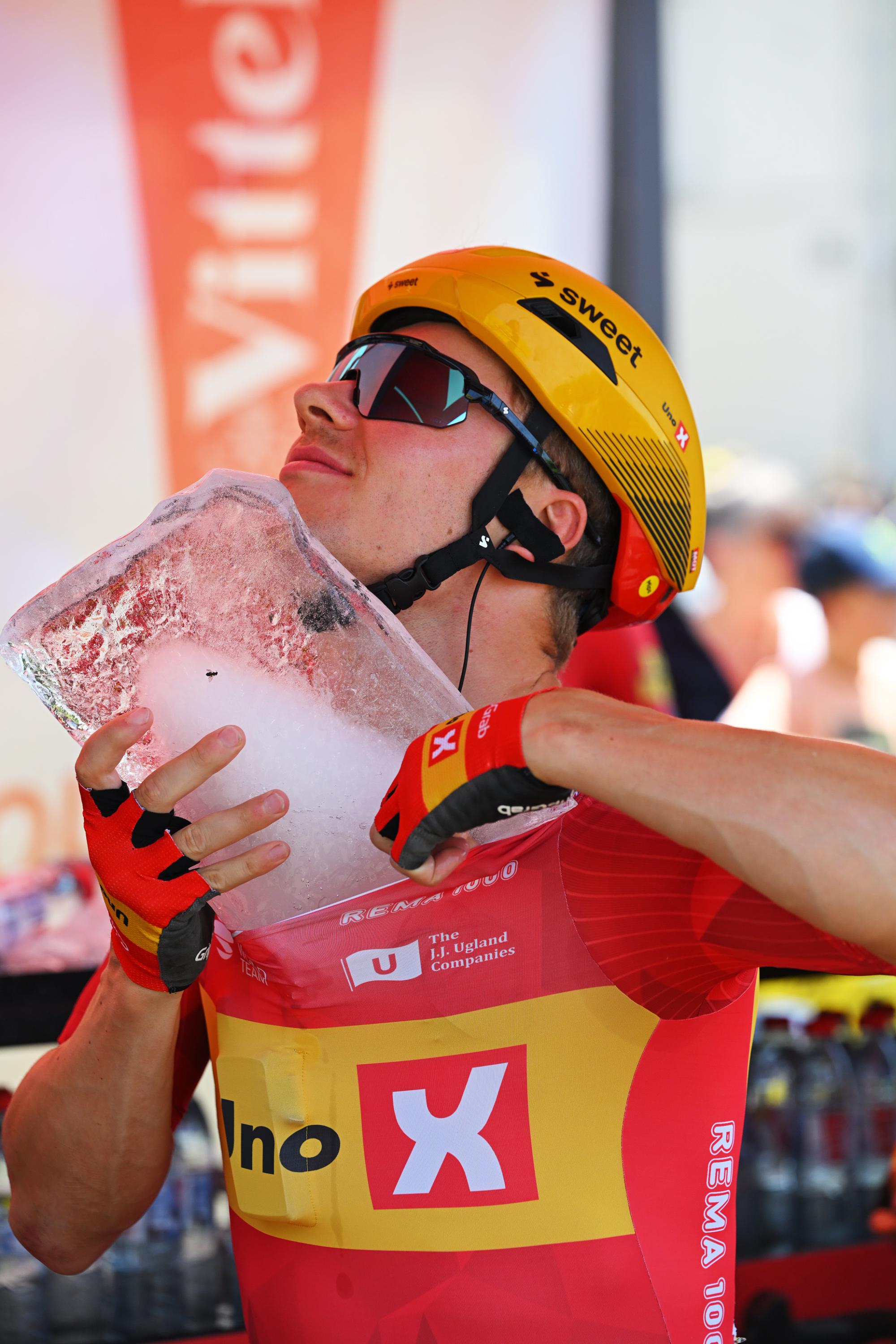 Jonas Abrahamsen tries to put a huge ice cube down the front of his jersey
