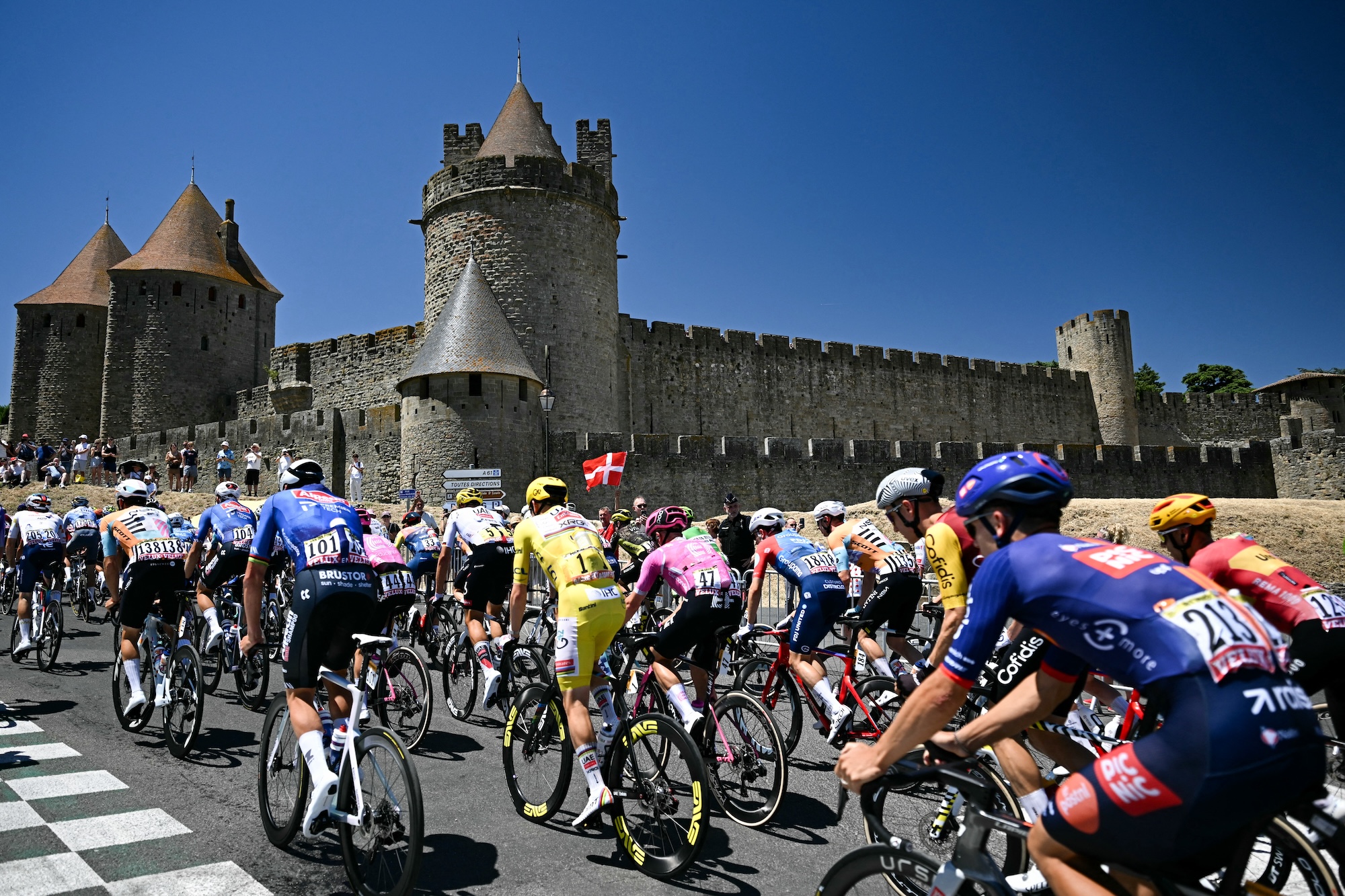 The pack takes the start of the 4th stage of the 113th edition of the Tour de France cycling race, 182 km between Carcassonne and Foix in southwestern France, on July 7, 2026. (Photo by Loic VENANCE / AFP)