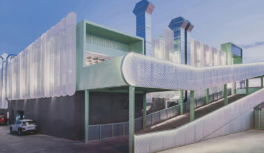 OOIIO wraps madrid auto center in permeable skin of metal slats