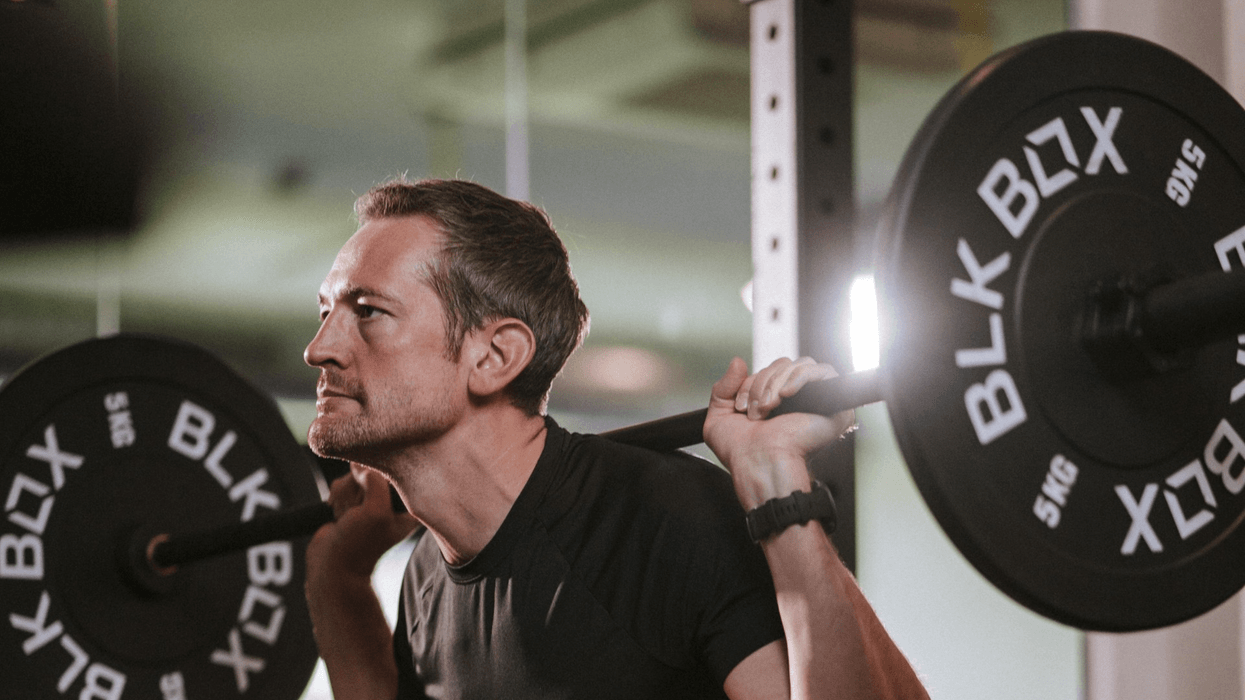 Personal Trainer performing a squat