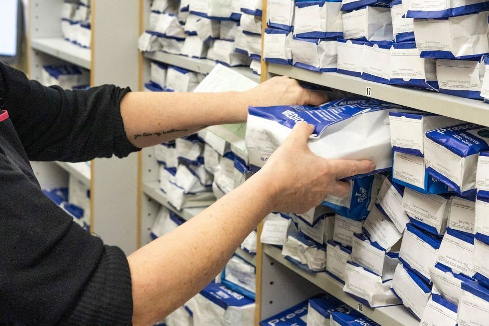 PHARMACIST PREPARING PRESCRIPTION