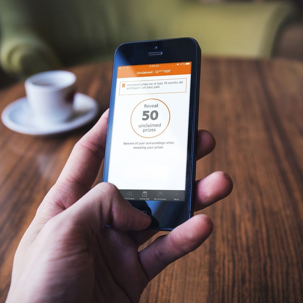 Premium Bonds user using NS&I app to check unclaimed prizes