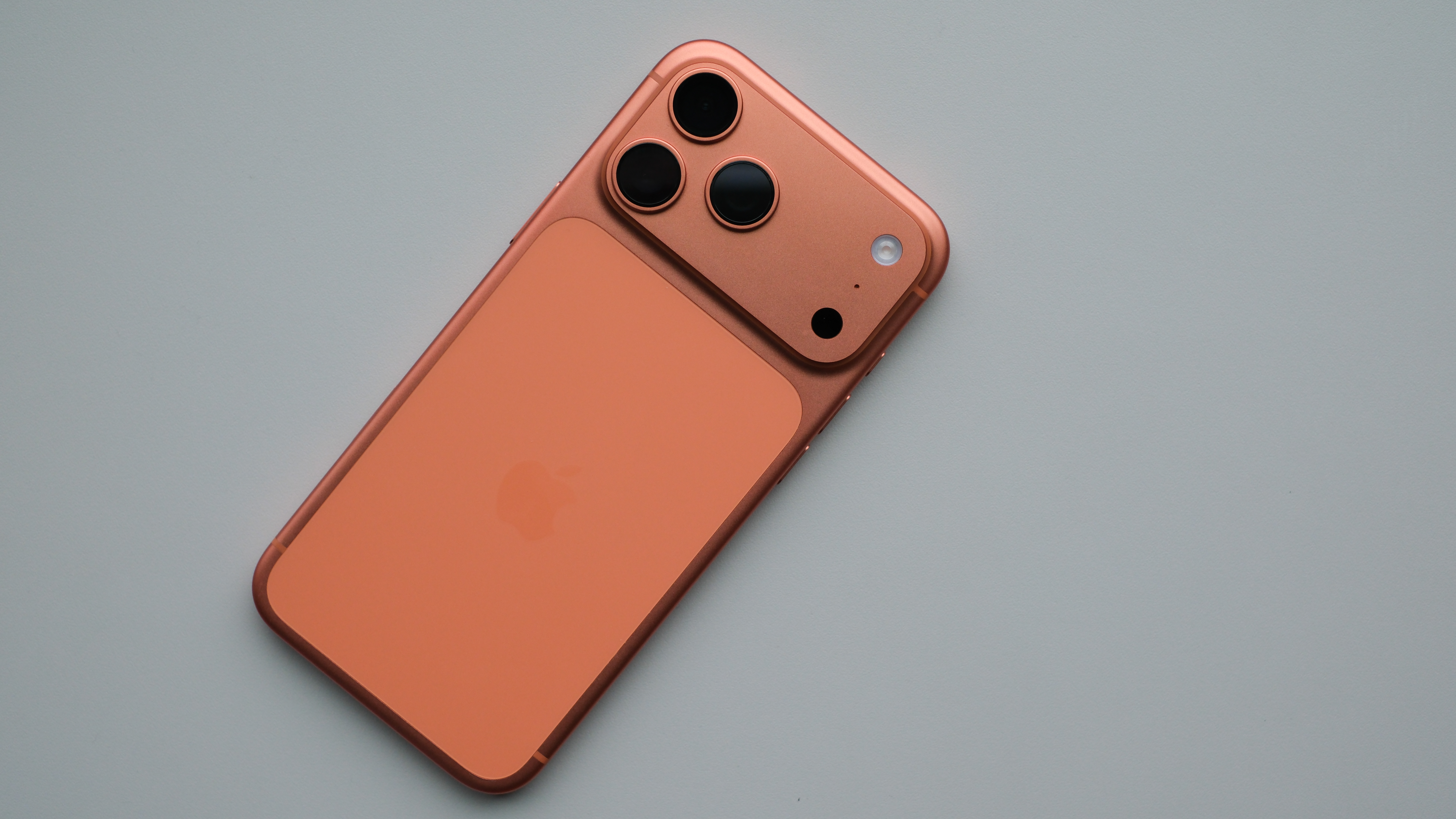 Apple iPhone 17 Pro Max in orange on a white surface